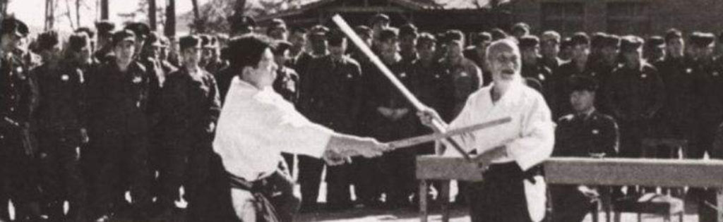 O-Sensei and Saito Sensei demonstrating weapons
